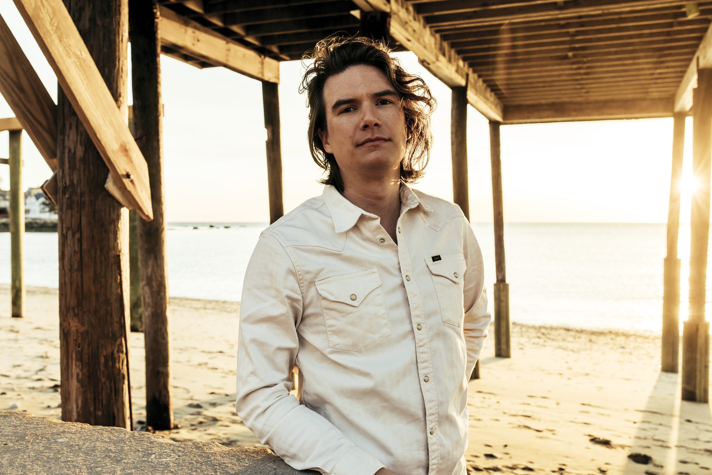 Greg Hall at the beach at golden hour